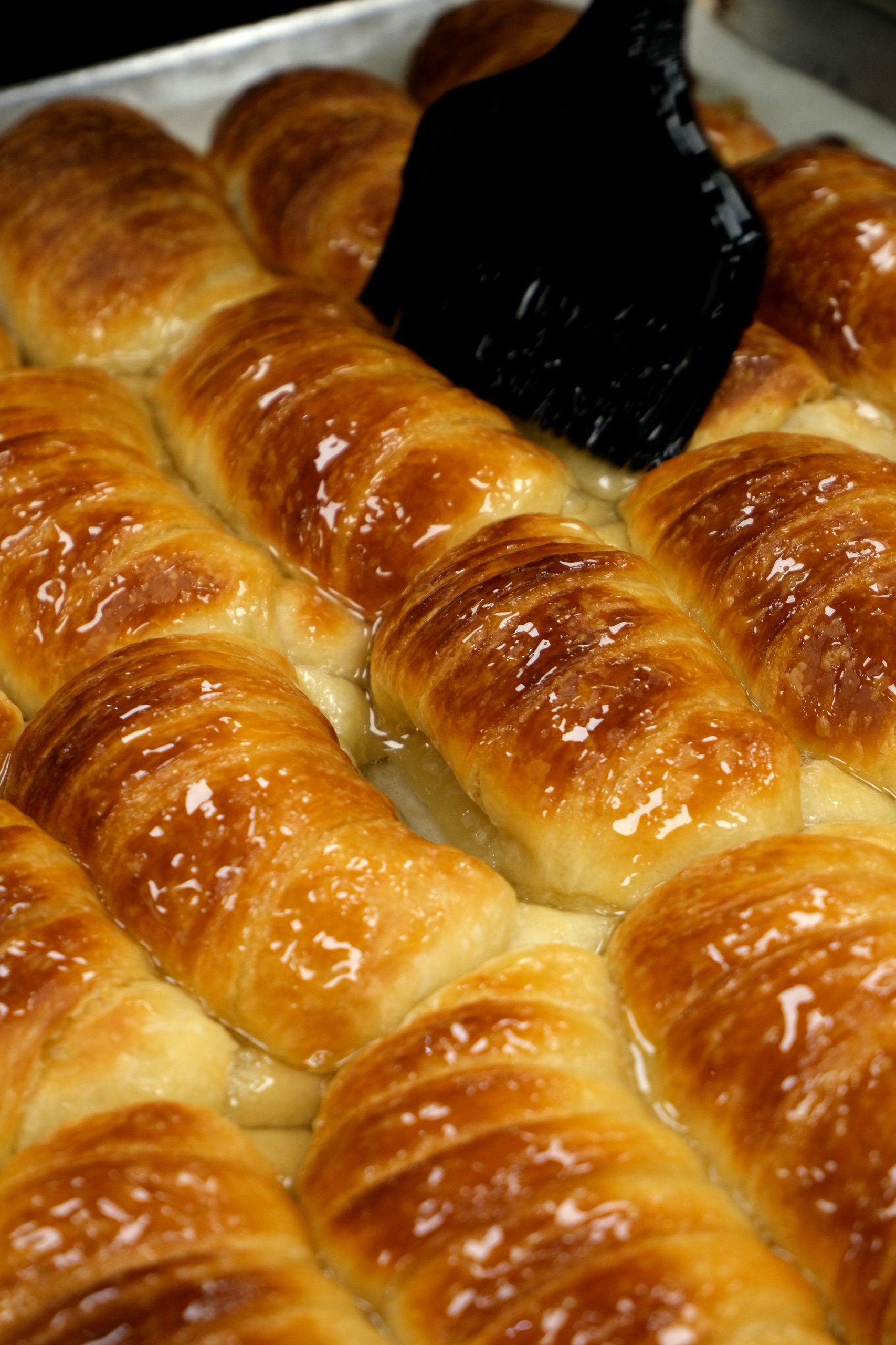 Tray of golden croissants at Pampas Fox Bakery